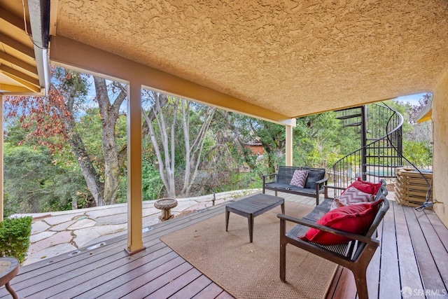 deck featuring stairs and an outdoor hangout area