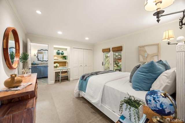 carpeted bedroom featuring ensuite bath, a closet, crown molding, and recessed lighting