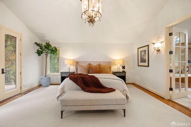 bedroom with baseboards, lofted ceiling, wood finished floors, access to outside, and a chandelier