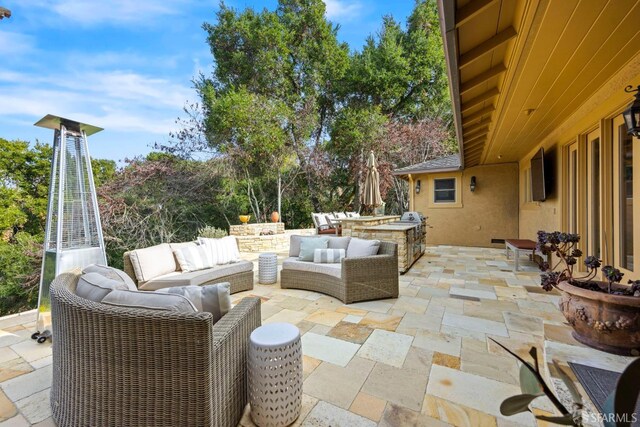 view of patio featuring grilling area and outdoor lounge area