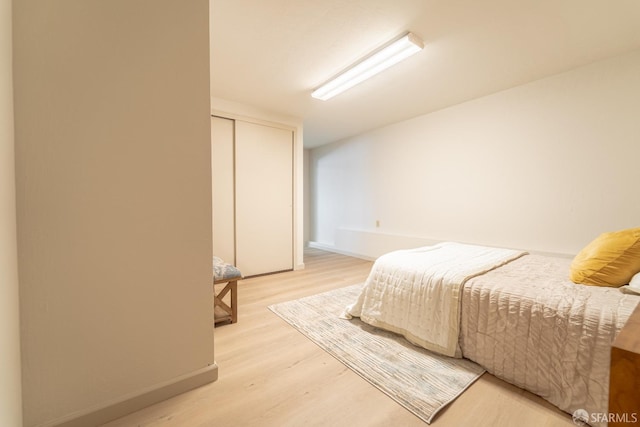 262 Topeka Ave, San Francisco, CA 94124 - bedroom featuring light wood-style flooring, a closet, and baseboards