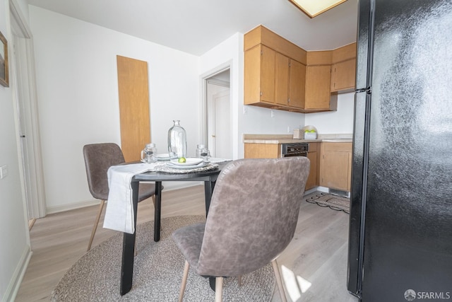 262 Topeka Ave, San Francisco, CA 94124 - kitchen with freestanding refrigerator, light wood-style flooring, light countertops, and baseboards