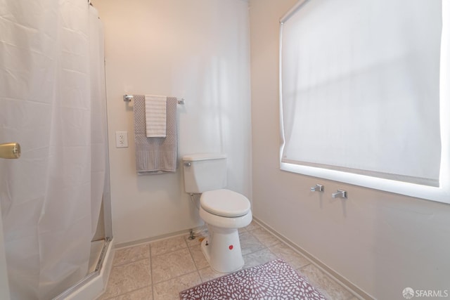 262 Topeka Ave, San Francisco, CA 94124 - bathroom featuring a shower stall, baseboards, and toilet