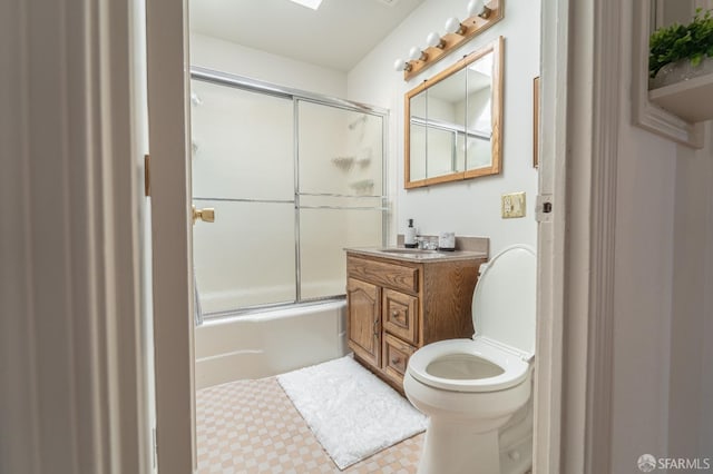 262 Topeka Ave, San Francisco, CA 94124 - bathroom with toilet, shower / bath combination with glass door, vanity, and tile patterned floors
