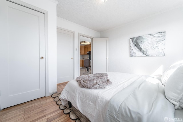262 Topeka Ave, San Francisco, CA 94124 - bedroom with light wood-type flooring, a textured ceiling, and crown molding