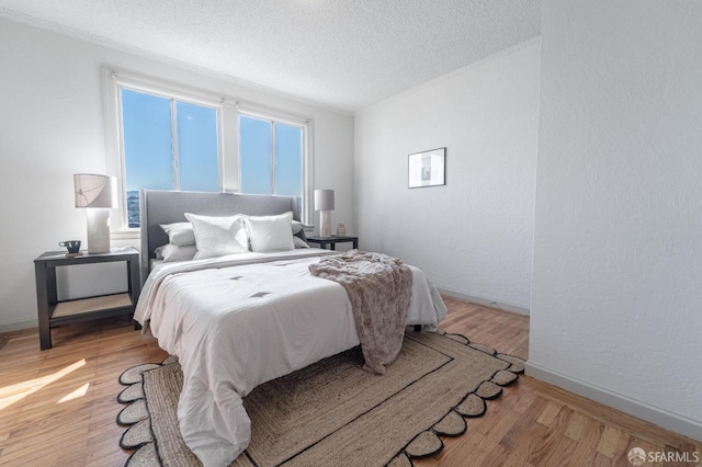 262 Topeka Ave, San Francisco, CA 94124 - bedroom featuring a textured ceiling, light wood finished floors, baseboards, and a textured wall