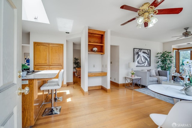 66 Baldwin Ave, Crockett, CA 94525 - bathroom with wood finished floors, ceiling fan, and a skylight