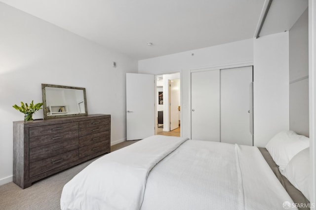 carpeted bedroom with a closet