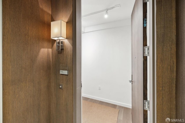 hallway featuring wood-type flooring