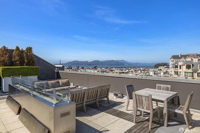 exterior space with a mountain view and outdoor lounge area