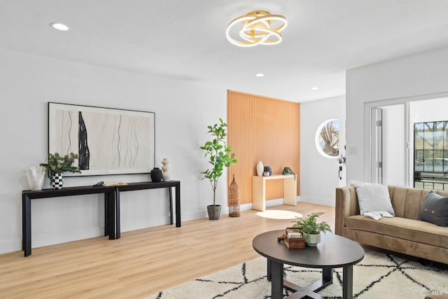 living room featuring recessed lighting, baseboards, and wood finished floors