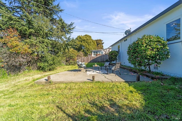 view of yard featuring a patio area and fence