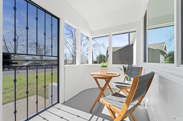 sunroom / solarium with vaulted ceiling