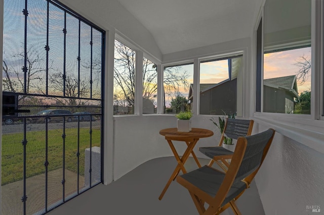 sunroom / solarium featuring lofted ceiling