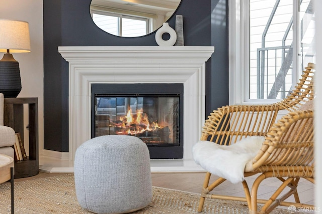 living area with a glass covered fireplace