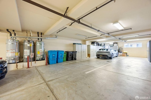 garage with gas water heater and water heater