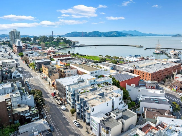 birds eye view of property with a city view and a water and mountain view