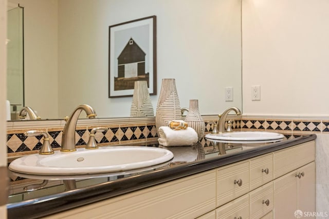 full bathroom featuring double vanity and a sink