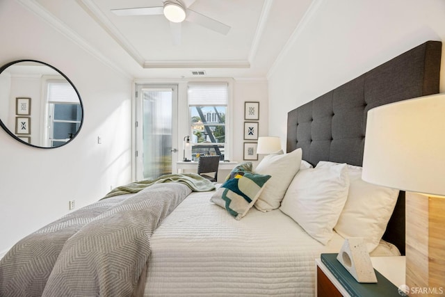 bedroom with visible vents, a raised ceiling, ceiling fan, access to outside, and crown molding