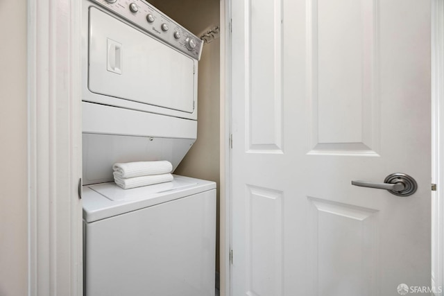 laundry area with laundry area and stacked washer and clothes dryer