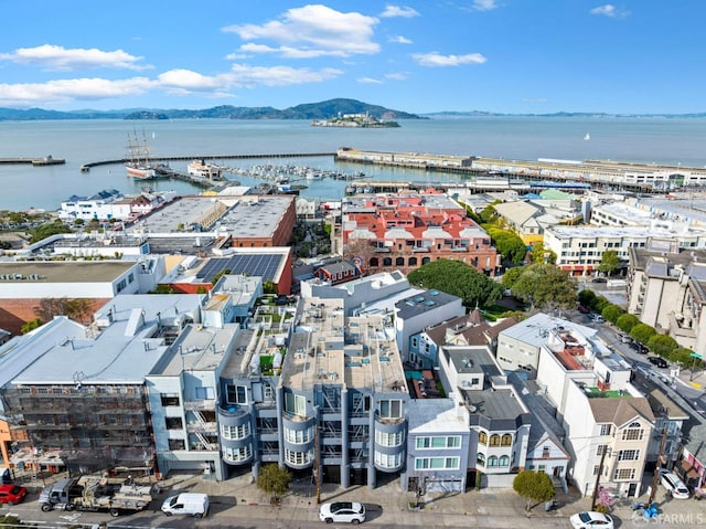 drone / aerial view featuring a water and mountain view