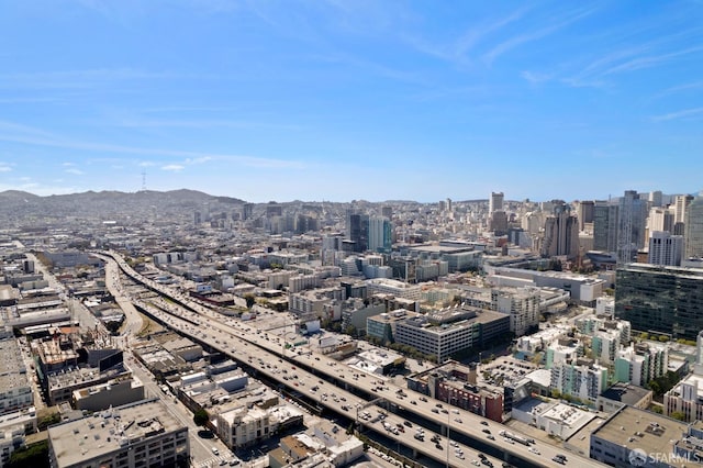 property's view of city with a mountain view