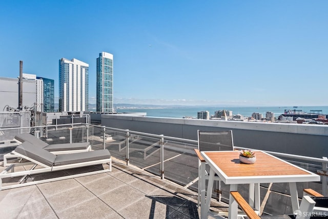 exterior space with a balcony and a water view