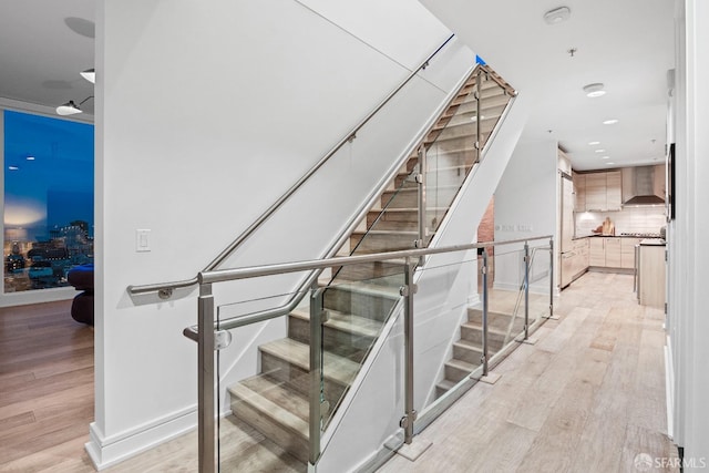 staircase featuring hardwood / wood-style floors