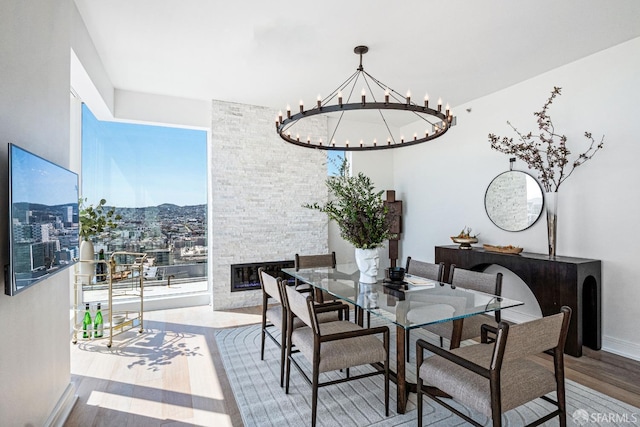 dining space featuring hardwood / wood-style floors, a chandelier, and plenty of natural light