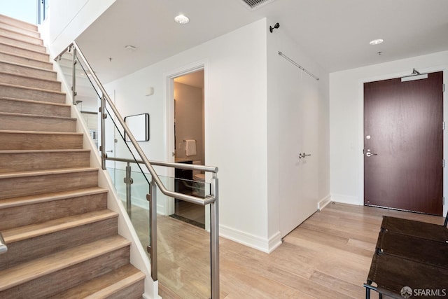 stairs with wood-type flooring