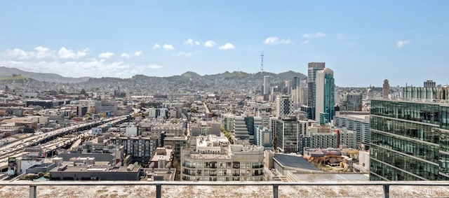 property's view of city with a mountain view