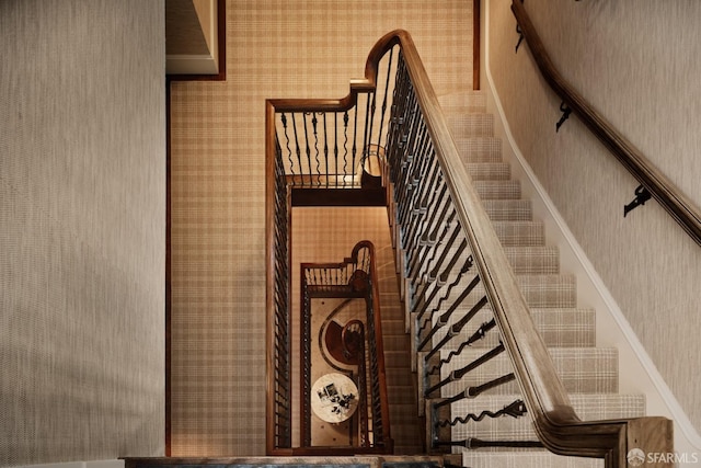 stairway with wallpapered walls