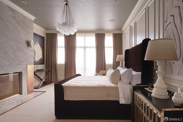 carpeted bedroom featuring visible vents, ornamental molding, a notable chandelier, and a textured ceiling