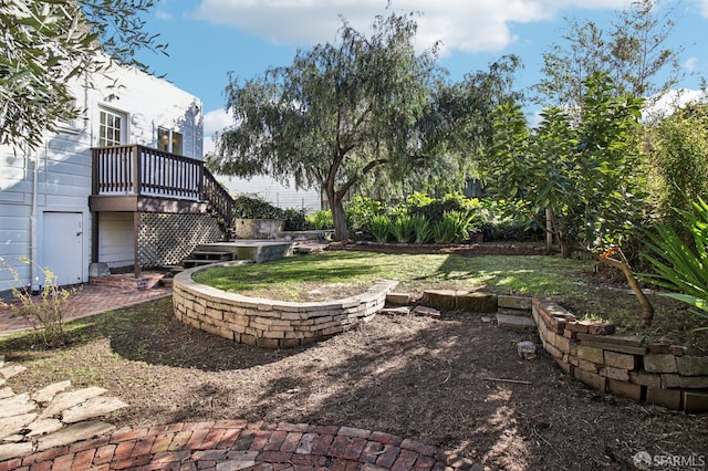 view of yard with a deck