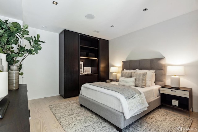 bedroom featuring light wood-type flooring