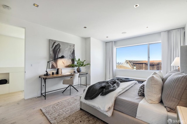 bedroom with light hardwood / wood-style flooring