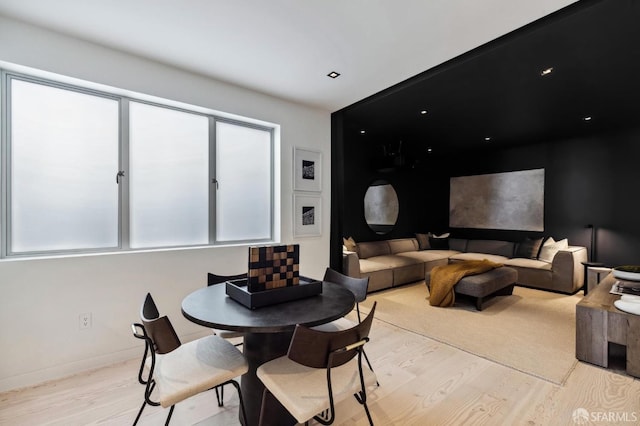 dining space with light hardwood / wood-style floors