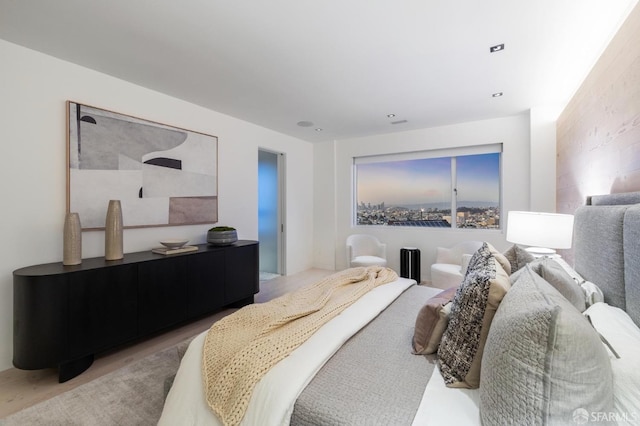 bedroom with light hardwood / wood-style floors