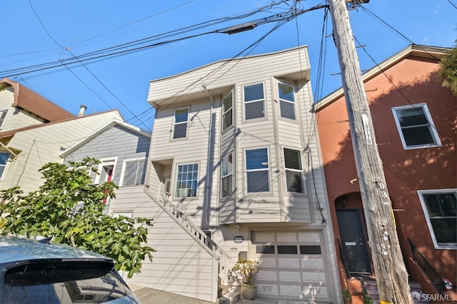 townhome / multi-family property with an attached garage