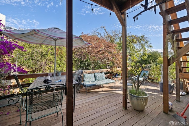 wooden terrace with an outdoor hangout area