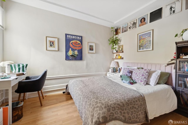 bedroom featuring wood finished floors