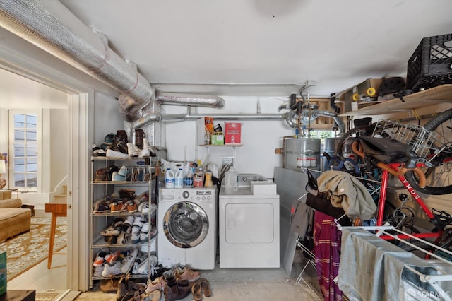 laundry area featuring laundry area, gas water heater, and washer and dryer