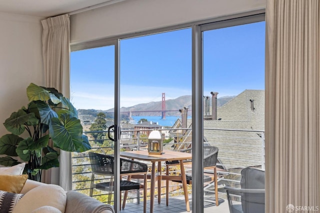 dining space featuring a water and mountain view