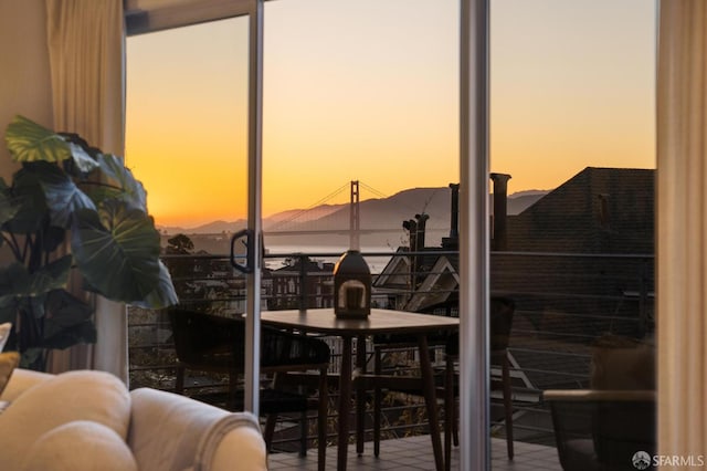 doorway to outside featuring a mountain view
