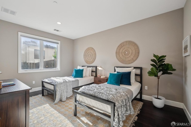 bedroom with wood-type flooring