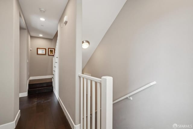 hallway with dark hardwood / wood-style floors