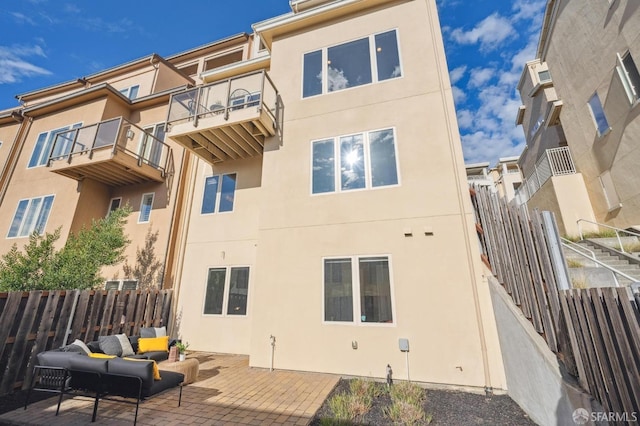 rear view of house with a patio area