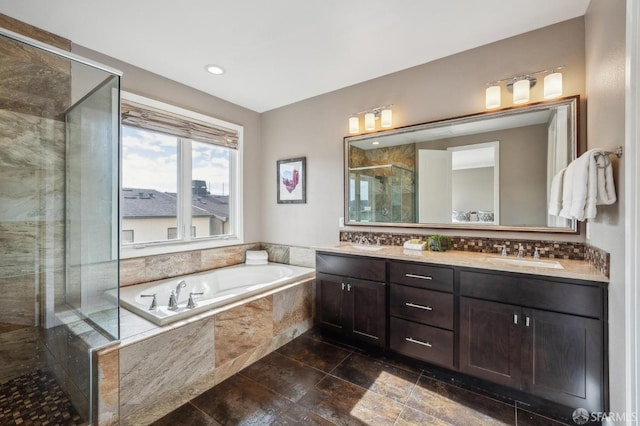 bathroom with separate shower and tub and vanity