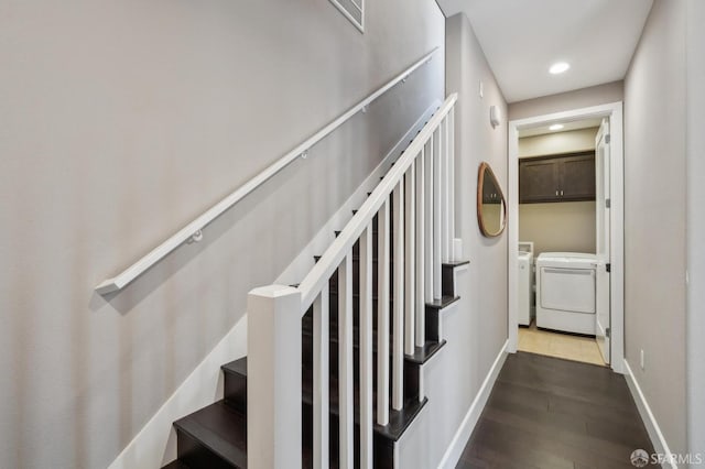 staircase featuring hardwood / wood-style flooring and washing machine and dryer