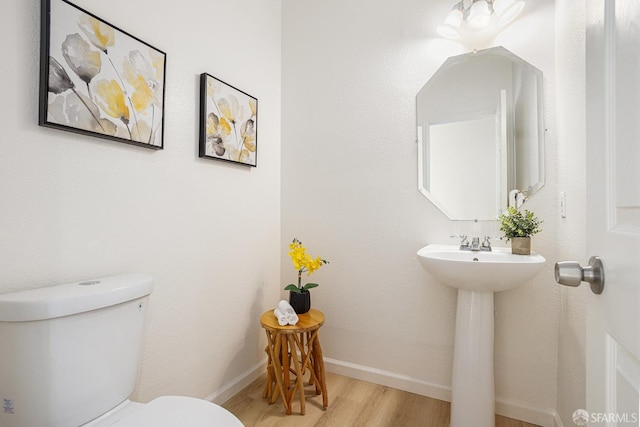 1845 Kern Mountain Way, Antioch, CA 94531 - bathroom featuring toilet, wood finished floors, baseboards, and a sink